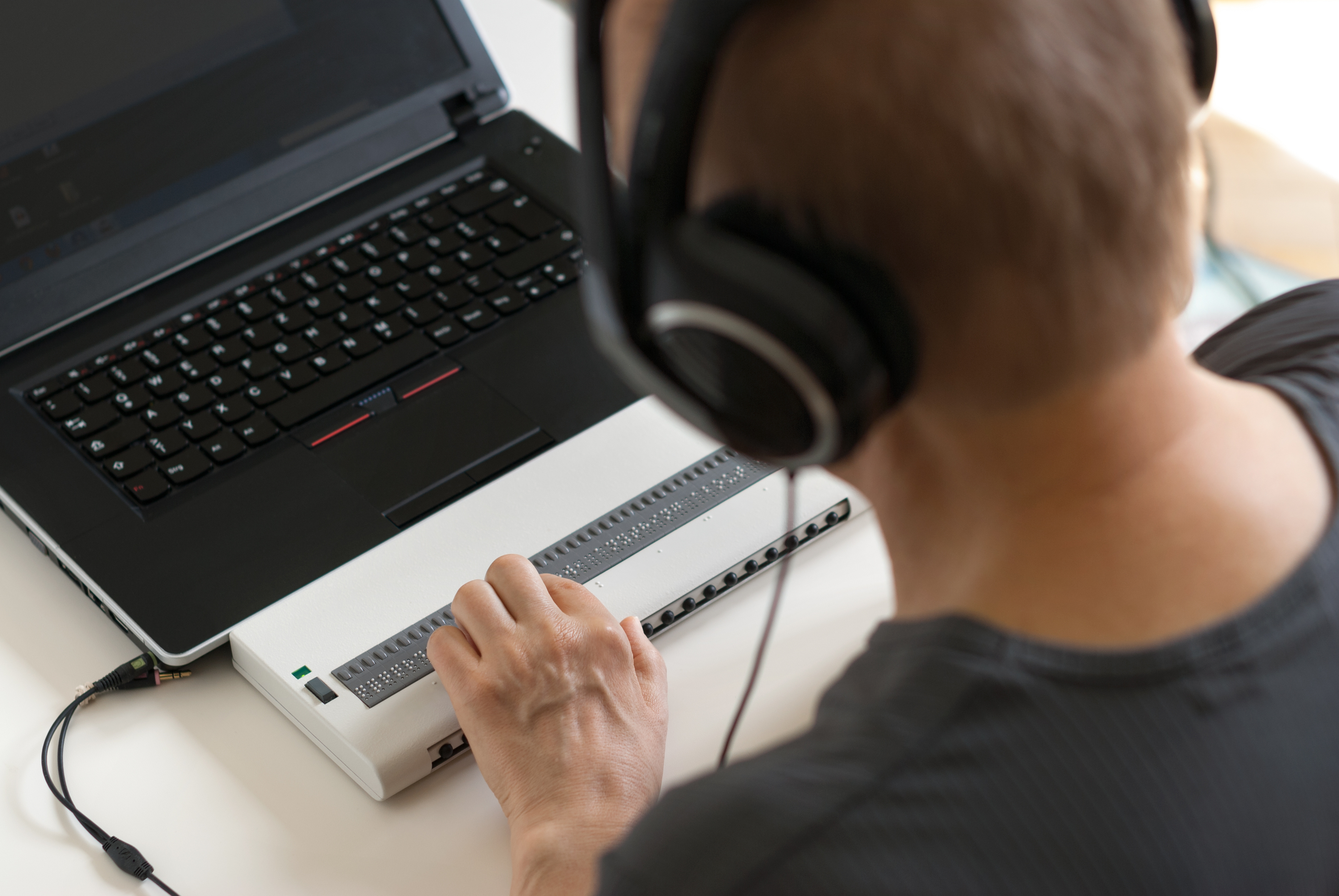 An individual is using assistive tools for screen reading to demonstrate accessibility 
