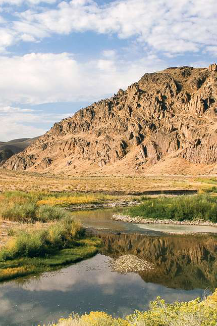 Photo of a Humboldt river with hills in the background