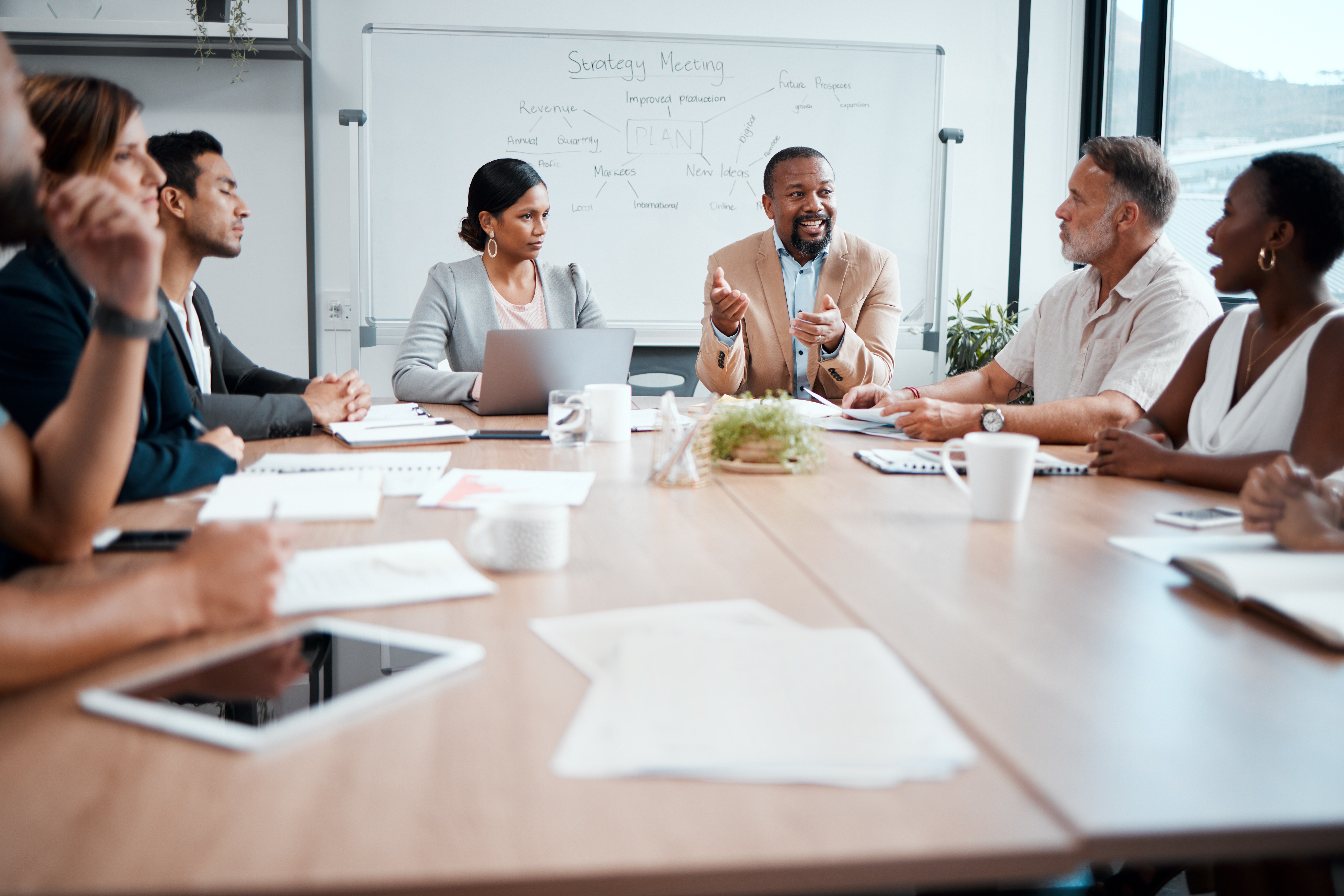 A group of co-workers collaborating on a project and speaking with each other