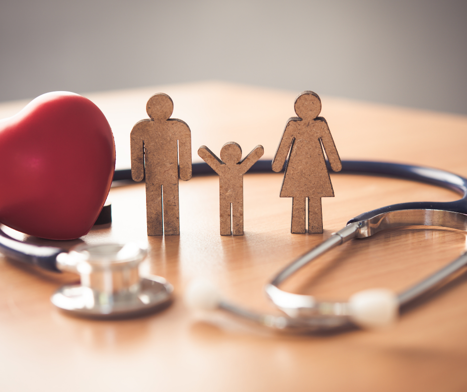 Medical insurance concept with family and stethoscope on wooden desk